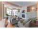 Bright living room with a fireplace, large windows, plush sofas, and elegant decor at 2035 Buchanan Pt, Lafayette, CO 80026