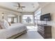 Bright main bedroom featuring a large window, dresser and sitting area at 2035 Buchanan Pt, Lafayette, CO 80026