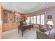 Well-appointed home office with custom built-ins, a large desk, and comfortable seating at 2035 Buchanan Pt, Lafayette, CO 80026
