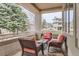 Cozy covered patio with comfortable seating and views of the surrounding neighborhood at 2035 Buchanan Pt, Lafayette, CO 80026