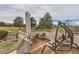 Relaxing patio area featuring comfortable seating and views of the golf course and mountains at 2035 Buchanan Pt, Lafayette, CO 80026