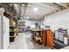 Spacious unfinished basement with storage shelves and a functional work area at 765 N Shawnee St, Aurora, CO 80018