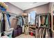 Walk-in closet providing ample storage space with shelving, clothing rods, and room for luggage at 765 N Shawnee St, Aurora, CO 80018