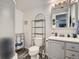 Bright bathroom featuring a walk-in shower, vanity, and shelving for storage at 13358 Briarwood Dr, Broomfield, CO 80020