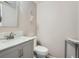 Cozy half bathroom featuring white fixtures and neutral wall color at 13358 Briarwood Dr, Broomfield, CO 80020
