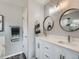 Modern bathroom with double sinks and brushed nickel hardware at 13358 Briarwood Dr, Broomfield, CO 80020