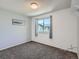 Well lit bedroom with a view and neutral tones at 13358 Briarwood Dr, Broomfield, CO 80020