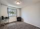 Bedroom with a comfortable chair and view of the neighborhood at 13358 Briarwood Dr, Broomfield, CO 80020
