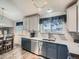 Bright kitchen featuring stylish cabinets, white countertops, and a breakfast nook in view at 13358 Briarwood Dr, Broomfield, CO 80020