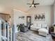 Cozy living room with comfortable seating, a display cabinet, and vaulted ceilings at 13358 Briarwood Dr, Broomfield, CO 80020