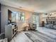 Living room with wood floors, a TV, an armchair, and a sliding glass door at 13358 Briarwood Dr, Broomfield, CO 80020