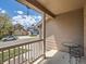 Covered porch with neutral siding, white railings, outdoor seating, and a view of the street at 13358 Briarwood Dr, Broomfield, CO 80020