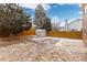 Backyard with a shed, patio, and a wooden fence at 2888 S Fundy St, Aurora, CO 80013