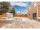 Backyard features a patio, shed, and a sliding glass door for easy access to the home at 2888 S Fundy St, Aurora, CO 80013