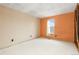 Bedroom with partially painted walls, one window and unfinished flooring at 2888 S Fundy St, Aurora, CO 80013