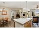 Dining area with wood floors, chandelier lighting, and access to the living areas at 8617 Gold Peak Dr # D, Highlands Ranch, CO 80130