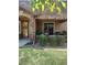 Charming front porch decorated with flower-filled planters and lush greenery at 8617 Gold Peak Dr # D, Highlands Ranch, CO 80130