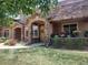 Charming front porch with stone accents and a well-maintained lawn at 8617 Gold Peak Dr # D, Highlands Ranch, CO 80130