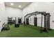 Home gym is well-equipped with free weights, heavy bags, and a turf floor at 8617 Gold Peak Dr # D, Highlands Ranch, CO 80130