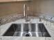 Close up of new stainless sink and updated counter tops at 8617 Gold Peak Dr # D, Highlands Ranch, CO 80130