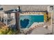 Aerial shot of the covered pool area with parking and an adjacent community building at 1830 Newland Ct # 319, Lakewood, CO 80214