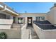 Exterior walkway displaying a secure, roof-covered access to units at 1830 Newland Ct # 319, Lakewood, CO 80214