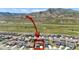 Aerial view of a residential neighborhood with red house outline near highway at 2125 S Orion St, Lakewood, CO 80228