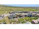 Aerial view showcasing well-manicured backyards, decks, patios, and putting green in a residential community at 2125 S Orion St, Lakewood, CO 80228