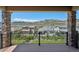 View of the neighborhood and mountains from the back porch of this home at 2125 S Orion St, Lakewood, CO 80228