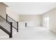 Finished basement with modern stairs, wet bar, and ample space for entertaining at 2125 S Orion St, Lakewood, CO 80228