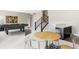 Basement includes pool table, seating, and stairs at 2125 S Orion St, Lakewood, CO 80228