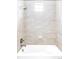 Well-lit shower with neutral tile and overhead shower fixture at 2125 S Orion St, Lakewood, CO 80228