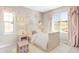 Cozy bedroom with natural light, decorative curtains, and charming furnishings at 2125 S Orion St, Lakewood, CO 80228