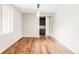 Bright dining room with hardwood floors, natural light, and a modern light fixture at 2125 S Orion St, Lakewood, CO 80228
