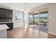 Bright dining area featuring mountain views and sliding glass doors to deck at 2125 S Orion St, Lakewood, CO 80228