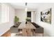 Dining room featuring a table with seating for eight and modern art at 2125 S Orion St, Lakewood, CO 80228
