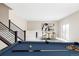 Spacious game room featuring a pool table, bar area, and dining table at 2125 S Orion St, Lakewood, CO 80228