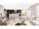 Open-concept living area with modern kitchen, dining space, and comfortable seating; perfect for entertaining at 2125 S Orion St, Lakewood, CO 80228