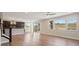 Open floor plan with hardwood floors, sliding glass doors to backyard and mountain views at 2125 S Orion St, Lakewood, CO 80228