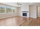 Living room with hardwood floors, three windows with mountain views and ceiling fan at 2125 S Orion St, Lakewood, CO 80228