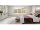 This staged main bedroom is beautifully lit with views of the mountains at 2125 S Orion St, Lakewood, CO 80228