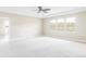 Spacious bedroom with tray ceilings, three large windows, and mountain views at 2125 S Orion St, Lakewood, CO 80228