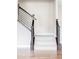 Staircase with dark wood banisters and white carpet at 2125 S Orion St, Lakewood, CO 80228