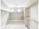 Spacious walk-in closet with ample shelving and storage, offering an organized and functional space at 2125 S Orion St, Lakewood, CO 80228
