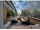 Relaxing balcony with comfortable seating, wood decking, and scenic views at 402 Garfield St, Denver, CO 80206