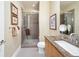 Modern bathroom featuring a glass-enclosed shower, granite countertop vanity, and contemporary fixtures at 402 Garfield St, Denver, CO 80206