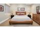 Cozy bedroom with decorative lamps, a leather platform bed, and warm, inviting decor at 402 Garfield St, Denver, CO 80206
