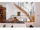 Open foyer with modern staircase, stainless railings, and natural light at 402 Garfield St, Denver, CO 80206