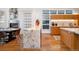 View of the kitchen and dining area, showcasing the marble countertops, modern lighting, and open layout at 402 Garfield St, Denver, CO 80206