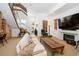 Spacious living room with a fireplace, comfortable seating, and a modern open staircase at 402 Garfield St, Denver, CO 80206